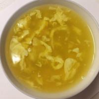 25. Egg Drop Soup · Served with fried noodle.