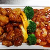 H5. Dragon and Phoenix · Two dishes in one plate: jumbo shrimp in red chili sauce and chunks of crispy chicken in spi...