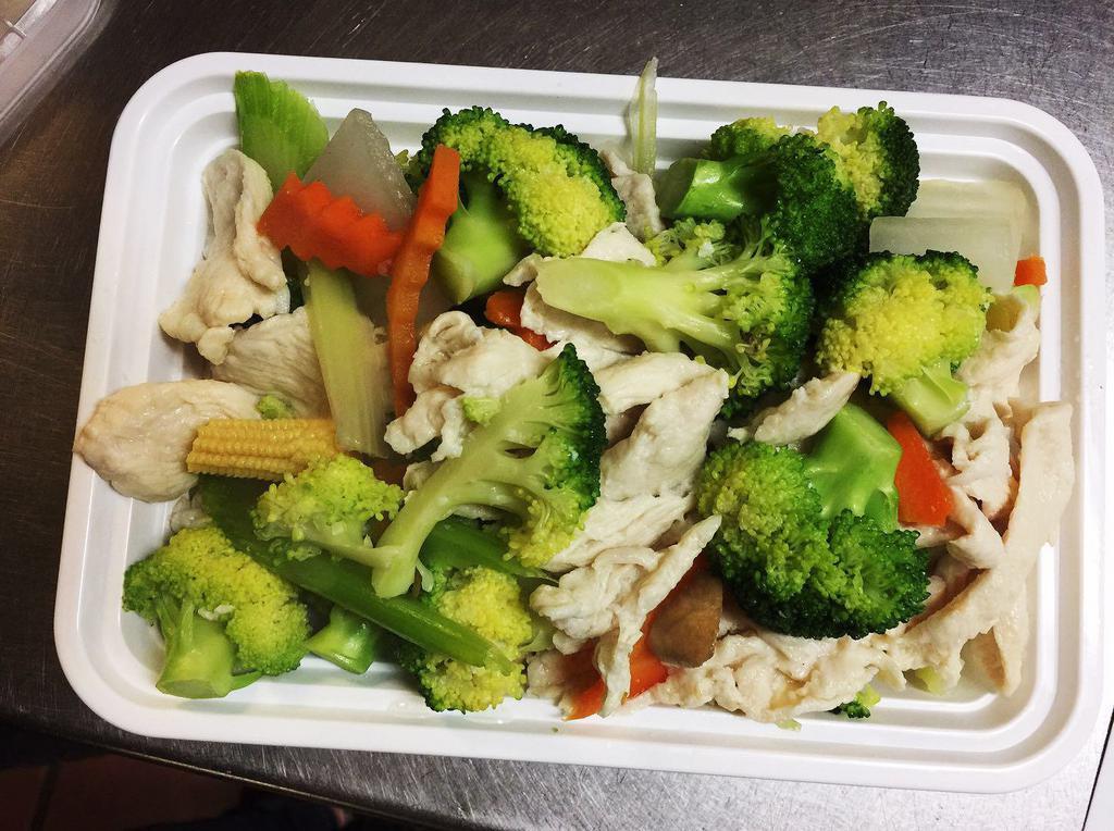 D5. Steamed Chicken with Mixed Vegetables · Steamed with white rice and sauce on the side.