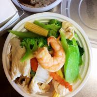 D6. Steamed Shrimp and Chicken with Mixed Vegetables · Steamed with white rice and sauce on the side.