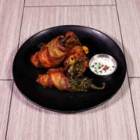 Bacon Wrapped Jalapenos · Tailgater bites. Fresh jalapenos stuffed with mixed cheese. Wrapped in Applewood smoked baco...