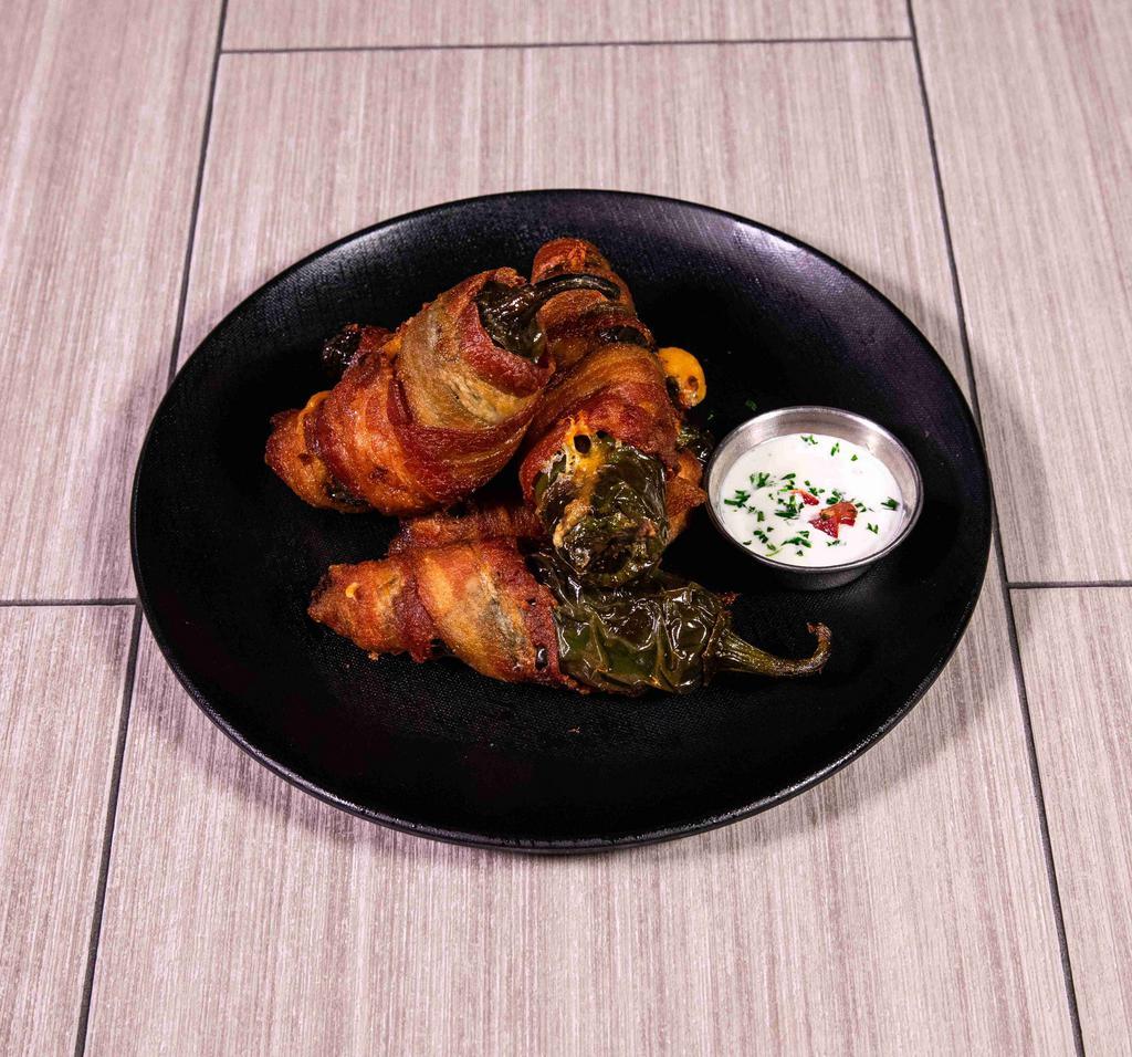 Bacon Wrapped Jalapenos · Tailgater bites. Fresh jalapenos stuffed with mixed cheese. Wrapped in Applewood smoked bacon and deep fried.