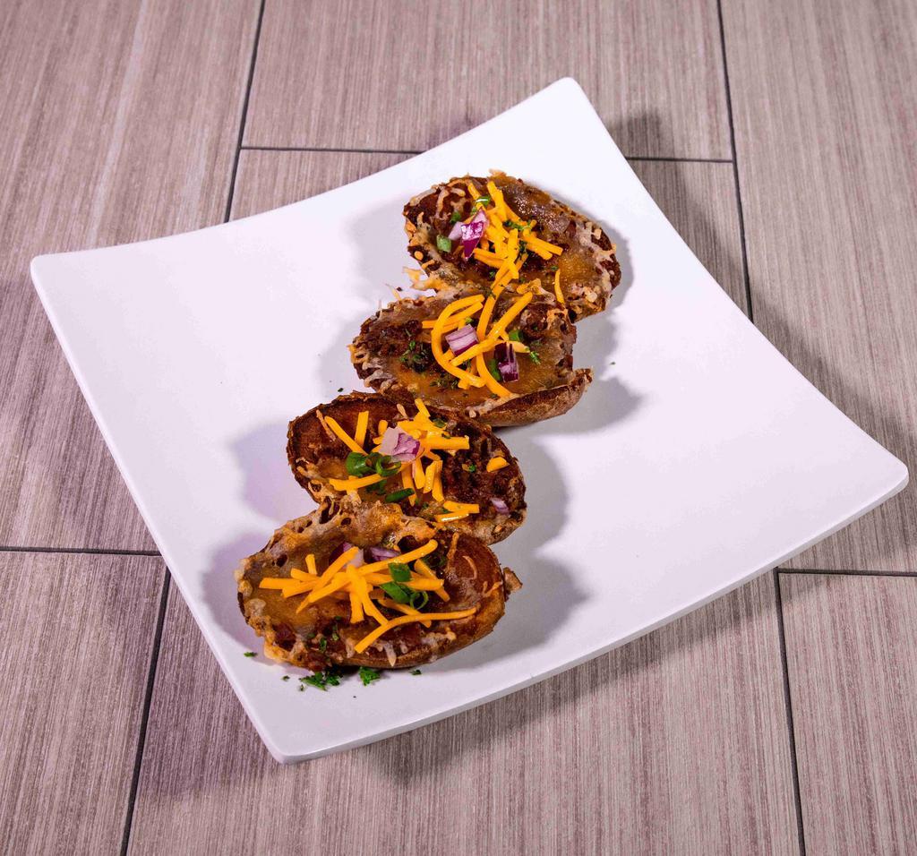 Smashed Potato Skins · Fried smashed potato skins with melted cheese and bacon crumbles. Served with sour cream.