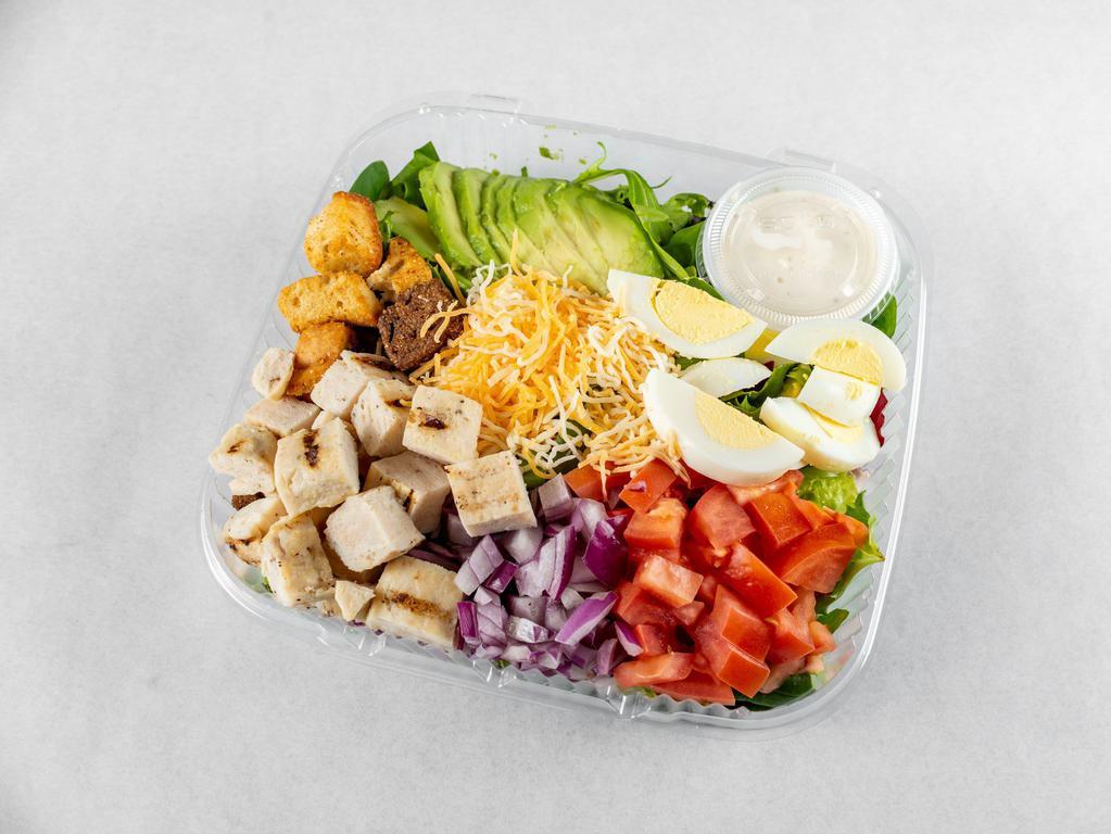 Cobb Salad · Fresh mixed greens, chopped hard-boiled eggs, tomatoes, bacon, Monterey Jack and Cheddar cheese and croutons. Served with your choice of dressing. 