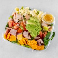 Chef Salad · Mixed greens, turkey, ham, cheese, eggs, bacon, avocado, tomato.