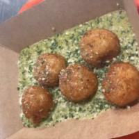 Risotto Arancini · Mushroom risotto made with roasted veggie stock, white truffle oil, and parmesan, rolled int...