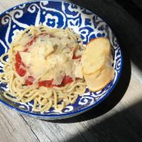 Spaghetti · Spaghetti topped with marinara and grated Parmesan.