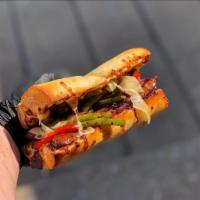 Sausage and Peppers Sandwich  · Grilled sausage withed mixed bell peppers, onions, and garlic in between two pieces of chees...