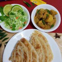 3. Chicken & Potato Curry with Paratha (Indian Flatbread) · Served with chicken soup & pickle medley.