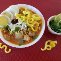11. Coconut Chicken Noodle Soup. · Yellow (wheat) noodle with chicken in creamy coconut soup topped with egg, onion, cilantro a...