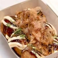 Takoyaki · House-made grilled octopus balls slathered w/ our special sauce, mayo, seaweed flakes & danc...