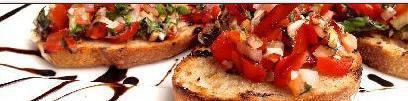 Bruchetta · Roma tomatoes, olive oil, garlic, basil, and bacon with a twist of lemon, topped with Parmes...