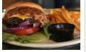 The And Still · Beef patty topped with two slices of American and mozzarella cheese, layered with sizzling c...