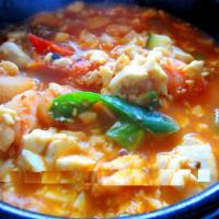 Soft Tofu Stew (순두부찌개) · Spicy stew of soft tofu, red chili paste, assorted vegetables with choice of meat.