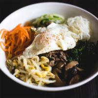 Bibimbap (비빔밥) · Rice mixed with choice of meat , egg and julienned vegetables with red chili paste on the si...