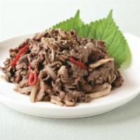 Bulgogi (불고기) · Grilled thinly sliced beef marinated in sweet soy, ginger, garlic and sesame sauce.