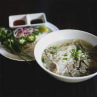 Pho Beef Noodle Soup (쌀국수) · Rare eye round over rice noodles in clear beef broth served with bean sprouts, Thai basil, c...