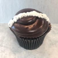 Chocolate Cream Cupcake · Chocolate cake filled with our signature buttercream, topped with fudge icing and a buttercr...