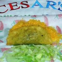 #32. Beef Taco · Crispy shell with shredded 100% beef, cheese and lettuce.