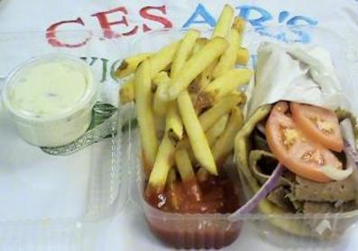 #64. Gyros Sandwich · Pita bread, beef, lamb, onions and tomatoes with a side of cucumber sauce. Add fries for an additional charge.