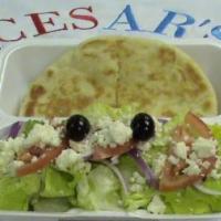 #68. Small Greek Salad and Pita · Lettuce, tomato, onion, cucumber, feta, Kalamata olives with Cesar’s Greek dressing.