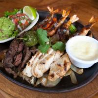 Agave Combo  · 4 of our brochette shrimp with beef and chicken fajitas. Served with pico de gallo and guaca...
