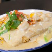 Chicken Enchiladas · Chicken tinga enchiladas with your choice of sour cream sauce or smooth avocado cream sauce.