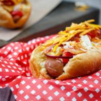 Chili Cheese Dog · Sausage served on a bun and topped with chili and cheese. 