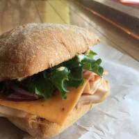 The Chicken Chipotle on Ciabatta · Oven roasted Chicken, chipotle cheddar, on a toasted Ciabatta. Served with our very own chip...