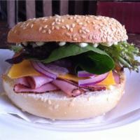 Ham and Cheddar Bagel Sandwich · Toasted Bagel, ham, cheddar, lettuce, red onion, and our very own Sprocket aioli.