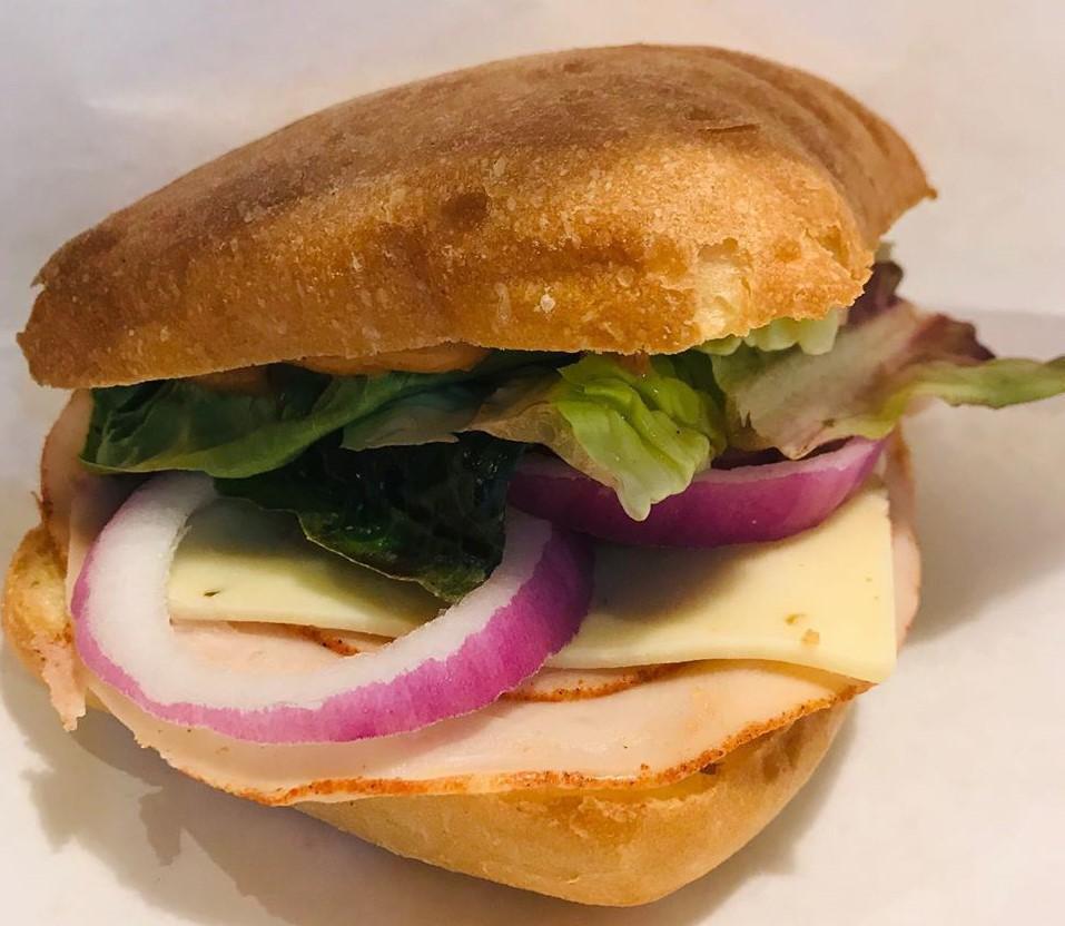 Turkey and Swiss Bagel Sandwich · Turkey and Swiss on a toasted bagel served with our Sprocket Aioli, lettuce, and red onion