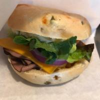 Roast Beef and Cheddar Bagel Sandwich · Toasted Bagel, roast beef, cheddar, greens, red onion, and our very own Sprocket aioli