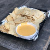 Chips and Queso  · The Best Queso from the West with a Texas Spin on it. 