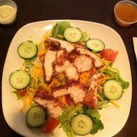 Tossed Green Salad · Topped with grilled or blackened chicken.
