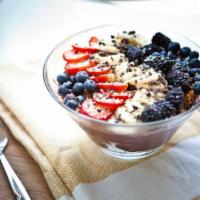 Organic Yogurt and Granola Bowl · Organic yogurt, local raw honey, gluten free granola and fresh strawberries.
