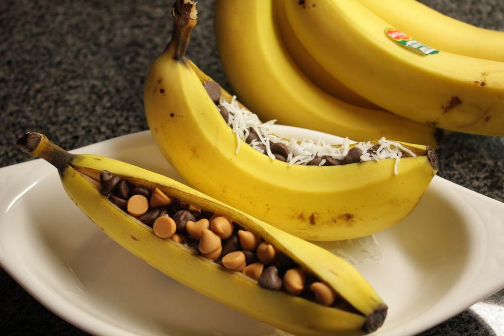 Banana Split Healthy Way · Banana, Almond Butter, raw cacao nib, shreded coconut flakes,blueberry, raw honey
