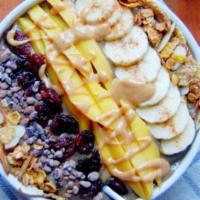 Very Berry Acai Bowl · Blended organic acai, banana, blueberries, apple juice and a splash of almond milk, topped w...