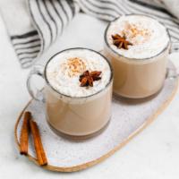 Chai Latte · Made by mixing steamed milk with black tea infused with spices topped with cinnamon powder.  