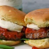 Pizza Burger · 100% beef burger with melted mozzarella cheese and marinara sauce.