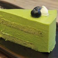 Matcha Mousse Cake · A matcha flavored mousse with layers of matcha cake in between.