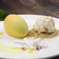 Mango Mousse Cake · A sweet and delicate white chocolate spray covers a mango mousse, layer diced mango lime jam...