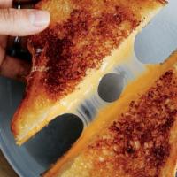 Adult Grilled Cheese · Fig, goat cheese and cheddar cheese on a multi grain bread or country white bread.