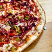 Damone  · Pepperoni, green chiles, roasted garlic and red bell peppers, red onions, and spicy slaw.