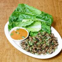 Lettuce Wrap Momo · Grilled momo fillings served with lettuce leaves and home-made sauces.