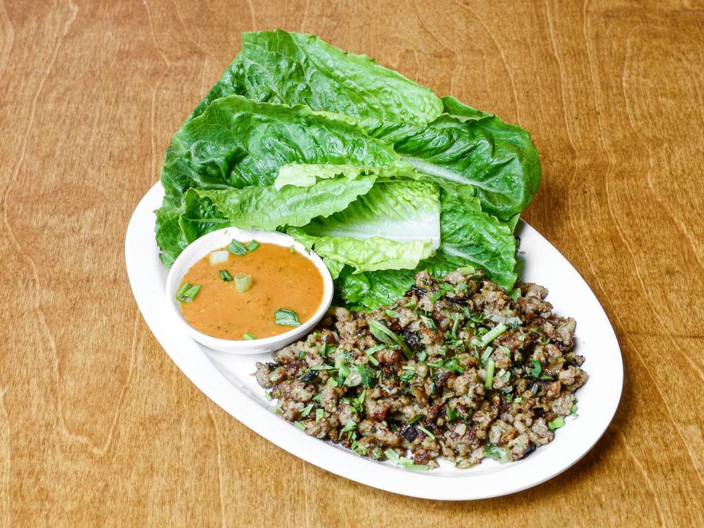 Lettuce Wrap Momo · Grilled momo fillings served with lettuce leaves and home-made sauces.