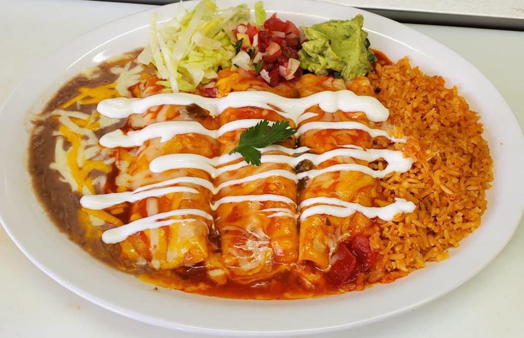 Rolled wet tacos (enchiladas)  · 3 corn tortillas with your choice of filling, and topped with enchilada sauce, cheese, and sour cream. Comes with rice and refried beans on the side. 