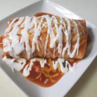Vegetarian wet burrito (also available with meat under main dishes)  · Comes with beans, rice, guacamole, and pico de gallo. Topped with ranchero sauce, cheese, an...