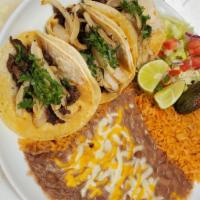 Taco Plate · Comes with 3 tacos with diced onion and cilantro and your choice of meat, rice, and refried ...