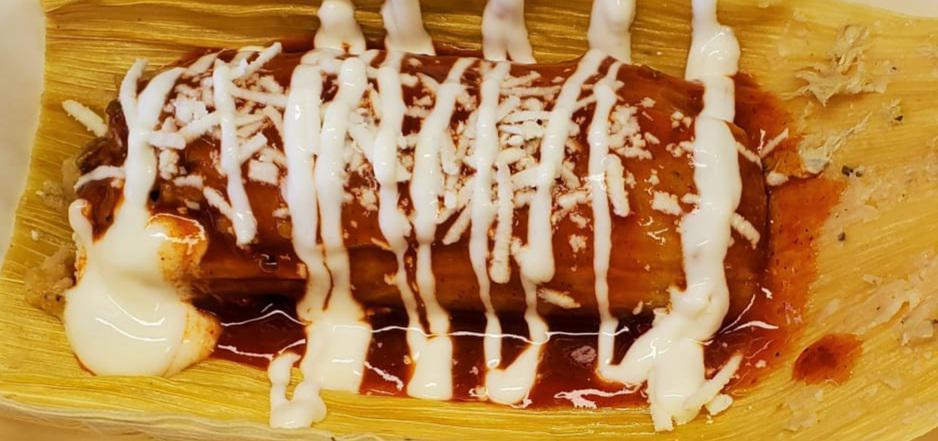 Chicken tamale · Comes with tomato sauce and sour cream on top 