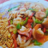 Camarones Rancheros · Comes with shrimp, mushrooms, onions, bell pepper, and ranchero sauce, with rice and refried...